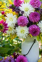 Floral arrangement. Jug of Dahlia, Solidago, Verbena bonariensis, Lythrum salicaria.