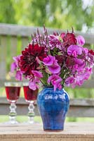 Pink summer posie made with Lathyrus latifolius, Lathyrus odoratus, Verbena hastata, Dahlia and Scabiosa