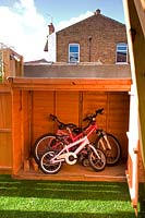 Shed to store family bikes. Small urban contemporary town garden. Ansari garden, Harrow