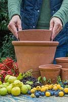 Stack the pots in height order from large to small, and use a small pot inside to rest your pot on