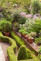 Looking across the parterre towards the sunny border. Hope House, Caistor, Lincolnshire, UK.