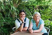 Jim Buckland and Sarah Wain sitting at the garden table.