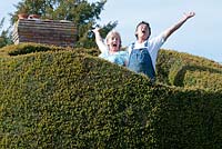 Jim Buckland and Sarah Wain standing in there tree house.