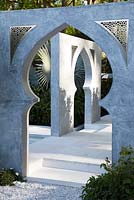 View accross a white marble gate in 'The Beauty of Islam' garden by Kamelia Bin Zaal at the RHS Chelsea Flower Show 2015