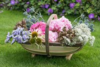 Cut garden flowers suitable for drying -hydrangeas, statice, gypsophila, sea holly and coneflowers, with dried seedheads of poppies and love-in-the-mist.