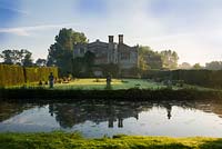 View of Mannington Hall in early morning, south aspect across moat. 