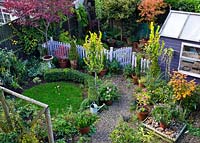 Colouful small back garden in Autumn in High Meadow Garden Staffordshire England 