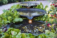 Three tiered Circular pools water feature. Hampton Court Flower Show 2014, the Bacchus Garden, design: Wardrop Designs. 