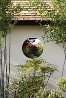 Circular view through garden building, with Phyllostachys nigra and Nandina domestica - A Japanese Reflection, RHS Malvern Spring Festival 2016