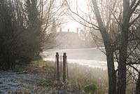 Mist rises from the River Lambourn that runs through Welford Park, Newbury, Berks