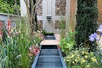 Water feature with associated planting. Pro Corda Trust - A Suffolk Retreat, RHS Chelsea Flower Show 2016 - Design: Frederic Whyte, Sponsor: Pro Corda Trust