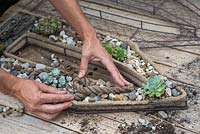 Adding a piece of aged rope to the wire frame - Making seaside wire frame