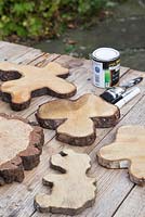 Oak tree slices, paintbrush, blackboard paint and a white paint pen