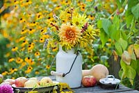 Jug of summer flowers - dahlia, sunflower, Persicaria, Solidago.