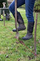 Dig along the string guide to mark the perimeter of the arbour base