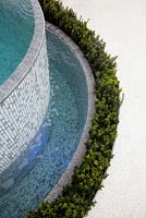 A plunge pool surrounded by a water feature