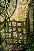 Riven oak gate leading from the front garden into the wild garden.