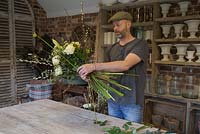 Adding Lonicera x purpusii, Ornithogalum Arabicum, Helleborus x sahinii, Rosa 'Avalanche', Viburnum tinus, Hippeastrum 'Christmas Gift', Ammi majus seed heads, Pussy Willow, Salix caprea, Eucalyptus gunnii and Chamelaucium to the bouquet