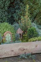 Winter wonderland box constructed with minature objects, lights, Scotch moss, Pinus foliage, Conifer, Moss and blue Spruce