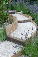 A circular, stepped gravel pathway surrounderd by lavender. Hampton Court Flower Show 2016 