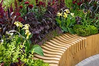 Raised wooden bed with cannas, Amaranthus 'Red Army', Perilla frutescens var. purpurascens, Thymus, and purple dahlias. Witan Investment Trust Global Growth Garden, RHS Hampton Court Flower Show 2016