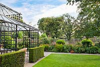 Pavillon in formal garden with clipped Buxus and Yew in borders