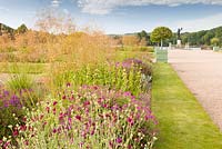 The Italian Garden at Trentham Gardens, Staffordshire - designed by Tom Stuart-Smith. Planting includes Geraniums, Knautia macedonica, Penstemons, Phlomis russeliana, Portuguese laurels in planters and Stipa gigantea