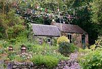 Sherpa's cottage and Nepalese prayer flags - July, Craigieburn, Moffat, Scotland