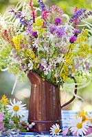 Jug of wildflowers. Persicaria, Salvia, Rumex, Galium verum, Silene vulgaris - Bladder campion, Centaurea jacea.