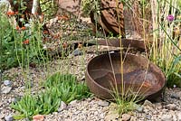 Hieracium aurantiacum, Valerian and Verbena bonaariensis, colonise an abandoned urban site. Designed by: Martyn Wilson, Sponsored by St Modwen Properties PLC.