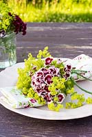 Summer table place setting with Dianthus barbartus - Sweet Williams and Alchemilla mollis