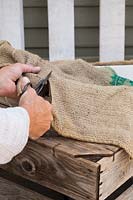 Cutting hessian sack for lining of plants