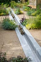 Water feature running through garden. Cruse Bereavement Care: 'A Time for Everything' - RHS Chatsworth Flower Show 2017 - Designer: Neil Sutcliffe - Sponsor: London Stone