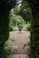 View through yew hedge into the Blue and White Herbaceous Garden