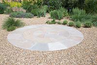 Buff Brown pavers, circular patio in gravel garden