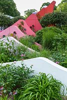 Chinese origin planting among pin blade 'mountains' in shades of red and pink - Silk Road Garden, Chengdu, China -  The Chengdu Silk Road Garden - RHS Chelsea flower show 2017 - Designer: Laurie Chetwood and Patrick Collins