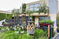 Greening Grey Britain Garden with  vegetables in containers on balcony, insect house and living roof bin store - RHS Chelsea Flower Show 2017 - RHS Chelsea Flower Show