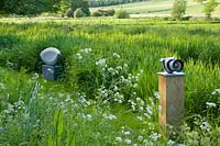 Meadow garden with modern sculptures - Asthall Manor, Oxfordshire