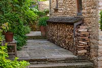 Stone steps with log store, Burford, Oxfordshire.