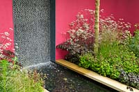 Contemporary garden with water feature. The Brewin Dolphin Garden, designer Robert Myers RHS Chelsea Flower Show 2013