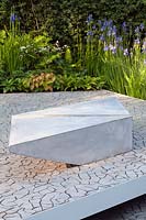 A modern concrete plinth seat in the RBC Waterscape Garden, RHS Chelsea Flower Show 2014, Designer Hugo Bugg