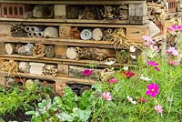 Wooden pallets filled with materials to create a wildlife haven for insects. Created by the Walton Charity. RHS Hampton Court Flower Show 2017.