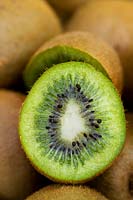 Kiwi fruit (Actinidia deliciosa) sliced in half