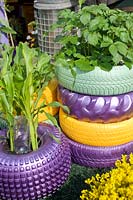 Painted vehicle tyres with crop of corn potatoes