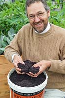 Simon Bland of Dalefoot Compost with a tub of Wool Compost