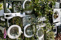 RHS Chelsea Flower Show 2010 Eden Project garden wall of recycled washing machines planted with climbers
