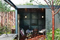 Winds of Change garden by Jamie Dunstan at RHS Chelsea Flower Show 2011. Steel pavilion with Prunus serula