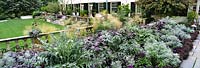 The Terrace Garden, Chanticleer Garden, Pennsylvania, USA. Large silver & purple themed herbaceous perennial border