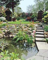 Rock garden with perennials and pond