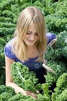 Girl with Brassica oleracea var. sabellica